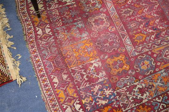 A Caucasian red ground carpet 403cm x 222cm